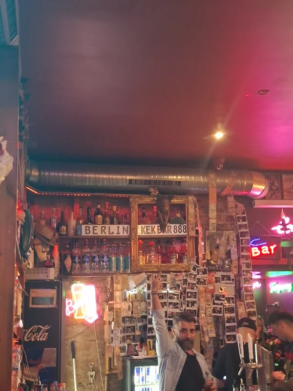 KEK Bar counter, neon signs and photo-covered walls
